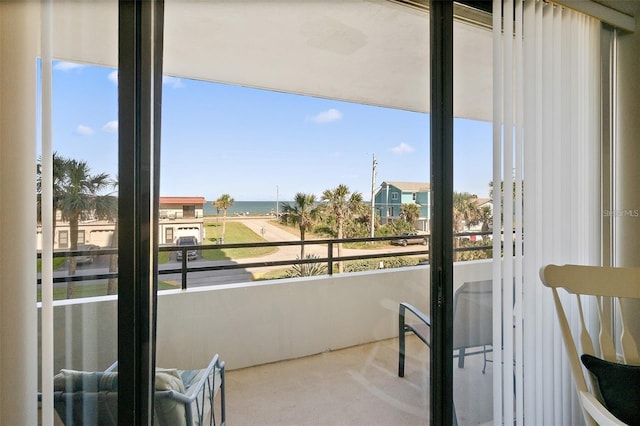 balcony featuring a water view