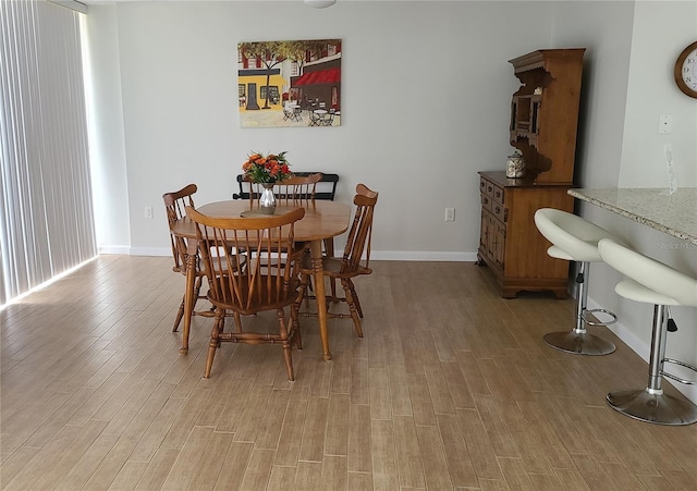 dining room featuring light wood-type flooring