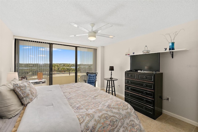 bedroom with light tile patterned flooring, a textured ceiling, access to outside, and ceiling fan