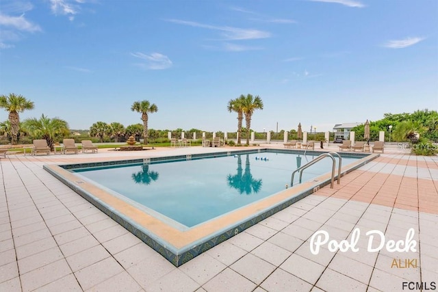 view of pool featuring a patio area