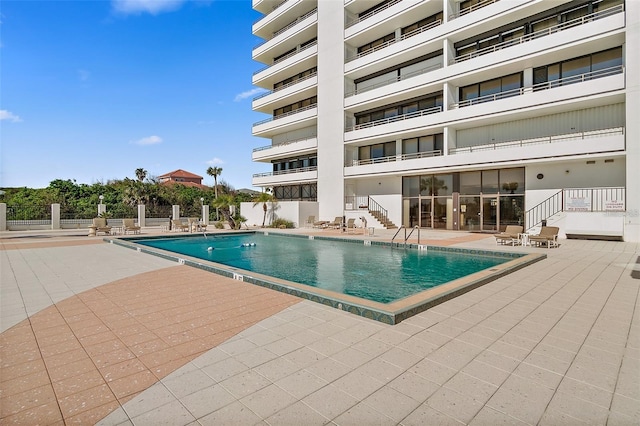 view of swimming pool with a patio