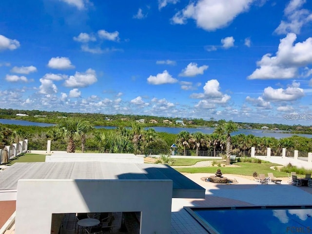 exterior space with a patio area and a water view