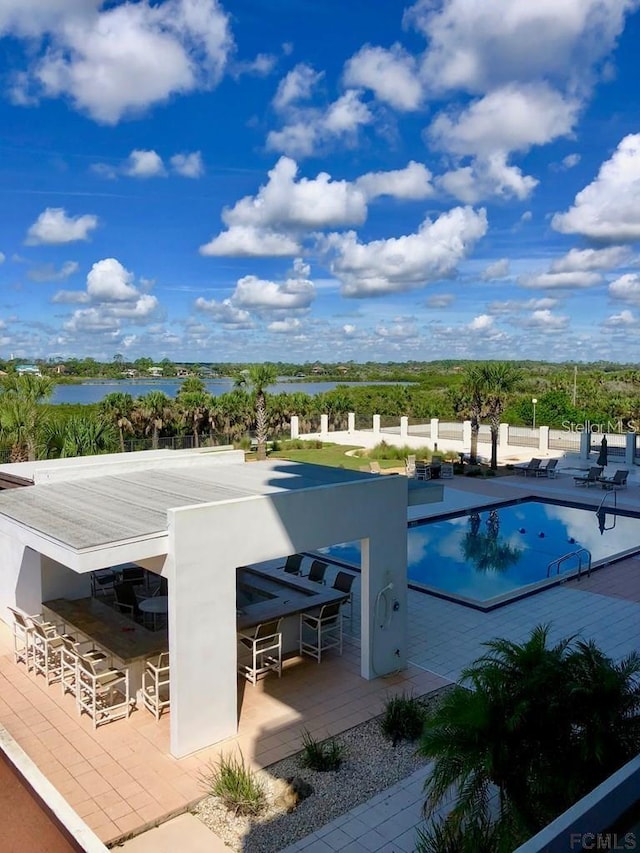 view of pool featuring a water view