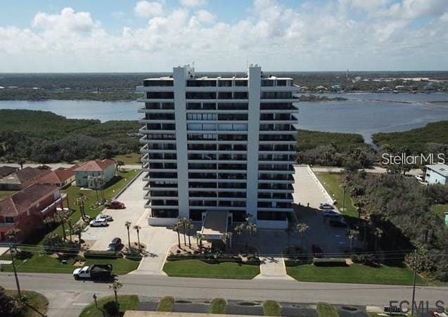 view of building exterior with a water view