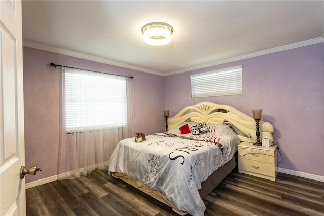 bedroom featuring crown molding and dark hardwood / wood-style floors