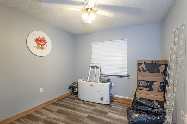 miscellaneous room featuring hardwood / wood-style floors, a textured ceiling, and ceiling fan