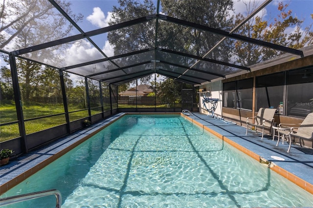 view of pool featuring a patio and glass enclosure