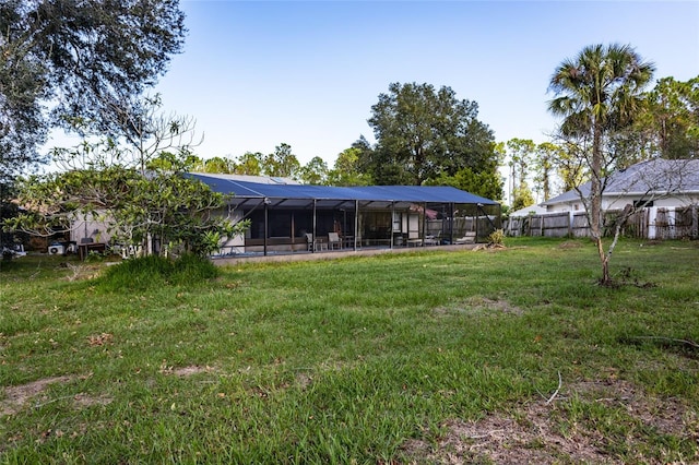 view of yard featuring glass enclosure