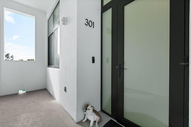 hallway featuring carpet