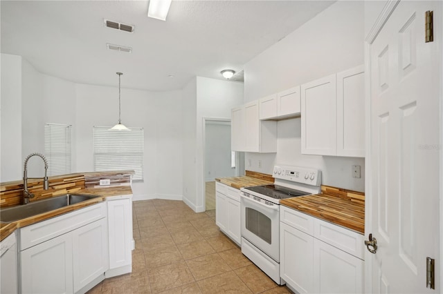 kitchen featuring wooden counters, sink, decorative light fixtures, white cabinets, and white appliances