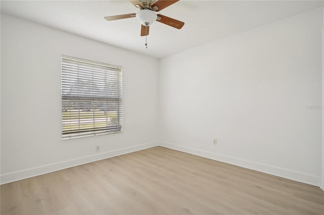 empty room with light wood-type flooring and ceiling fan