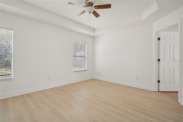 unfurnished room featuring ceiling fan and light wood-type flooring