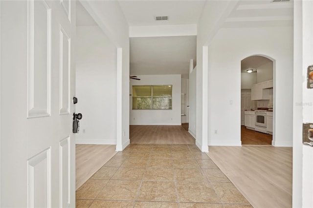 hallway with light wood-type flooring