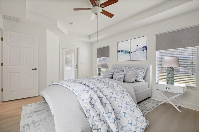 bedroom featuring light hardwood / wood-style flooring and ceiling fan