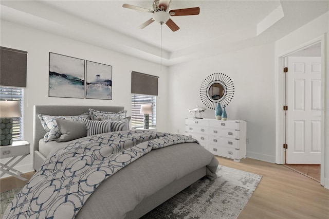 bedroom featuring light hardwood / wood-style flooring and ceiling fan