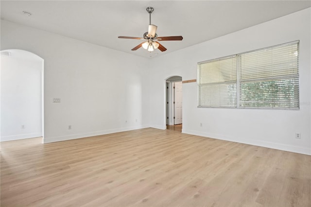 spare room with light hardwood / wood-style floors and ceiling fan