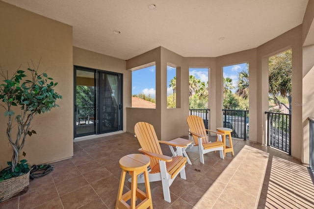 sunroom featuring a wealth of natural light