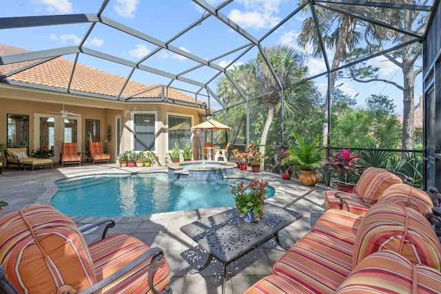 view of pool with an in ground hot tub, a patio area, ceiling fan, and an outdoor living space