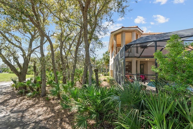 view of yard with a lanai