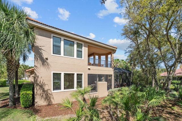 rear view of house featuring a balcony