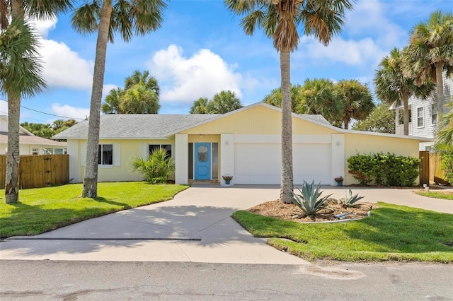 ranch-style house with a garage and a front lawn