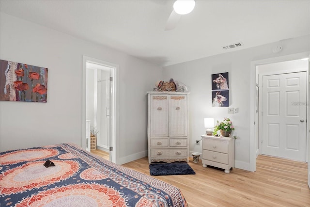 bedroom with ceiling fan, connected bathroom, and light hardwood / wood-style flooring