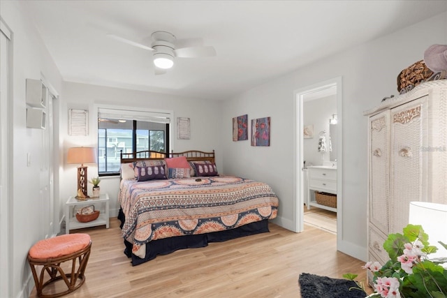 bedroom featuring light wood-type flooring, ceiling fan, and connected bathroom