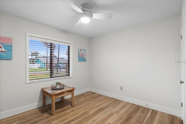 unfurnished room with ceiling fan and light wood-type flooring