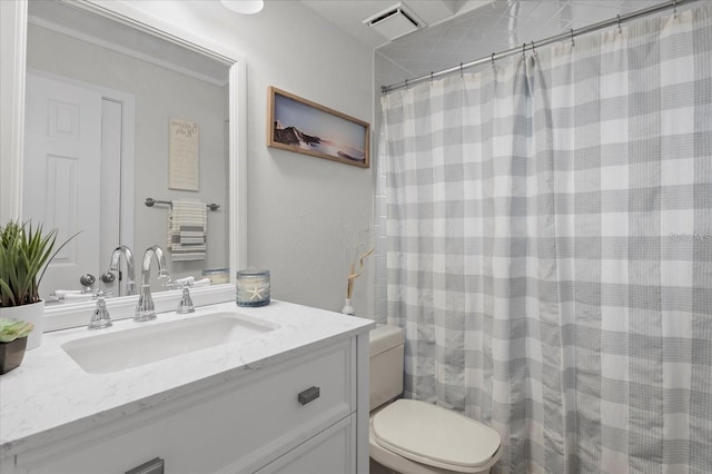 bathroom with walk in shower, vanity, and toilet