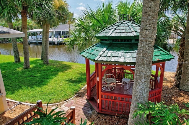 view of yard with a gazebo and a water view