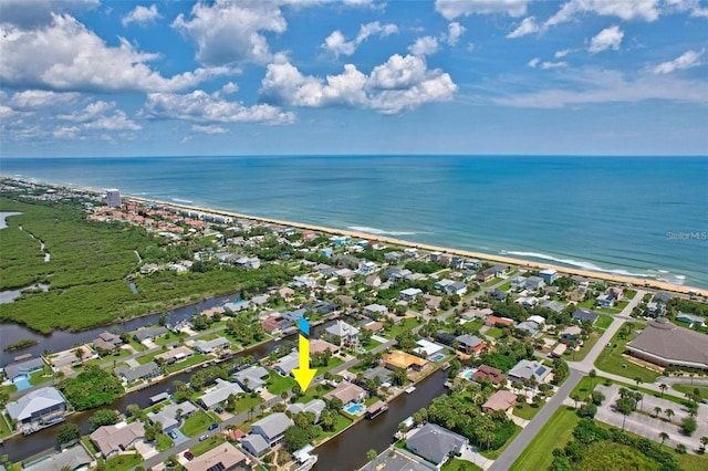 bird's eye view featuring a beach view and a water view