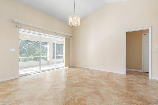 tiled spare room with lofted ceiling and a notable chandelier