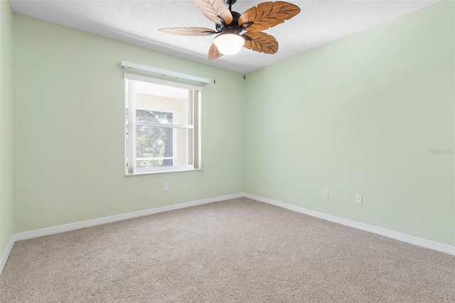 empty room with carpet, a textured ceiling, and ceiling fan