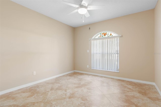 spare room featuring ceiling fan