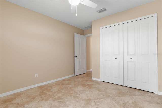 unfurnished bedroom with a closet and ceiling fan