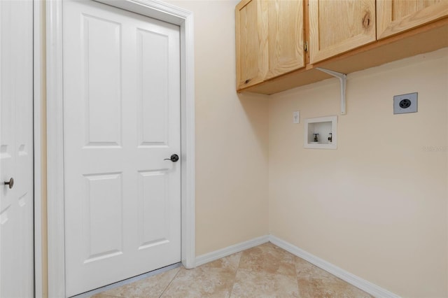 laundry area with cabinets, light tile patterned floors, washer hookup, and electric dryer hookup