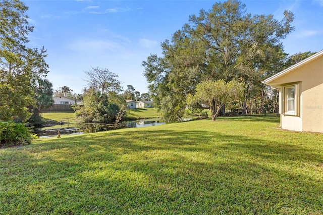 view of yard with a water view