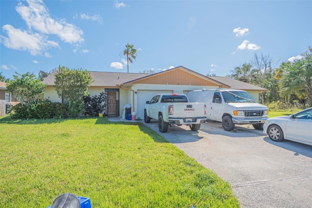 ranch-style home with a garage and a front lawn