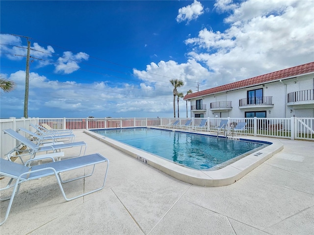 view of swimming pool with a patio area