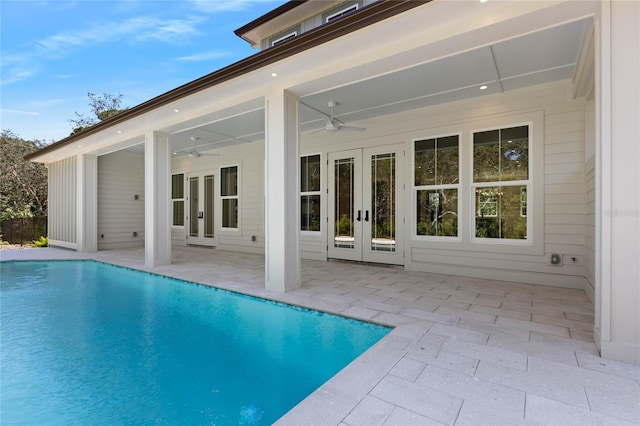 view of pool with a patio area, ceiling fan, and french doors