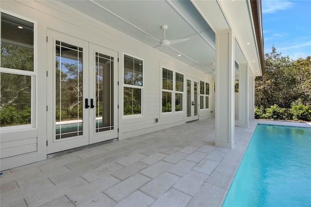 view of pool with a patio area, ceiling fan, and french doors