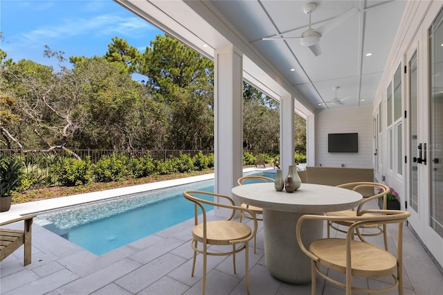 view of pool with ceiling fan and a patio