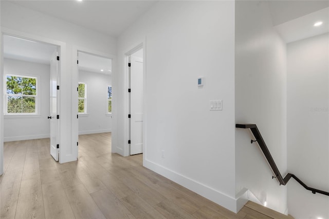 corridor with light wood-type flooring