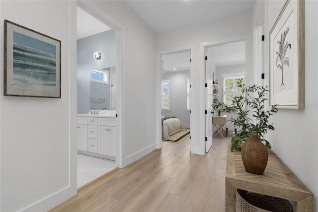 hallway featuring light hardwood / wood-style flooring