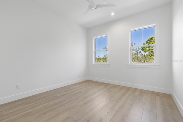 unfurnished room featuring light wood-type flooring and ceiling fan