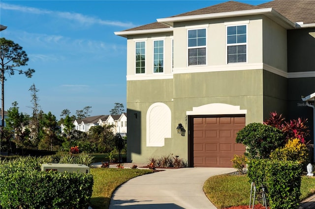 view of front of property with a garage