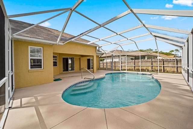 view of pool featuring a patio area and a lanai