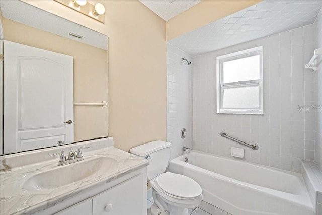 full bathroom with vanity, toilet, tiled shower / bath combo, and a textured ceiling