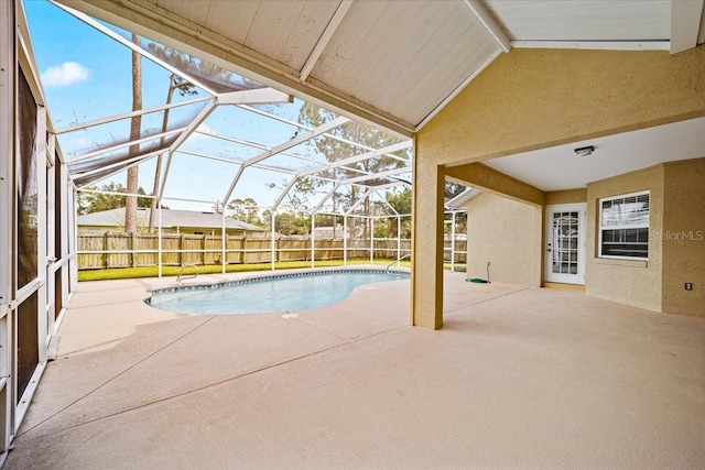 view of pool with a patio area and a lanai