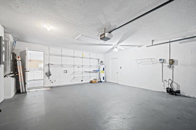 garage featuring ceiling fan, a garage door opener, and electric water heater